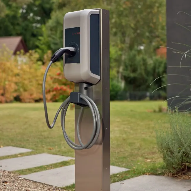 EV charging station installed outdoors, providing conveient electric vehicle charging in a modern, eco-friendly setting.