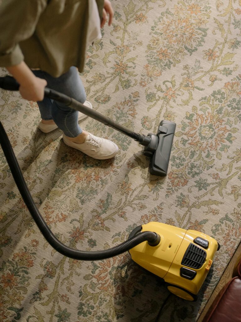 "Professional cleaners using industrial vacuum in corporate office lobby."