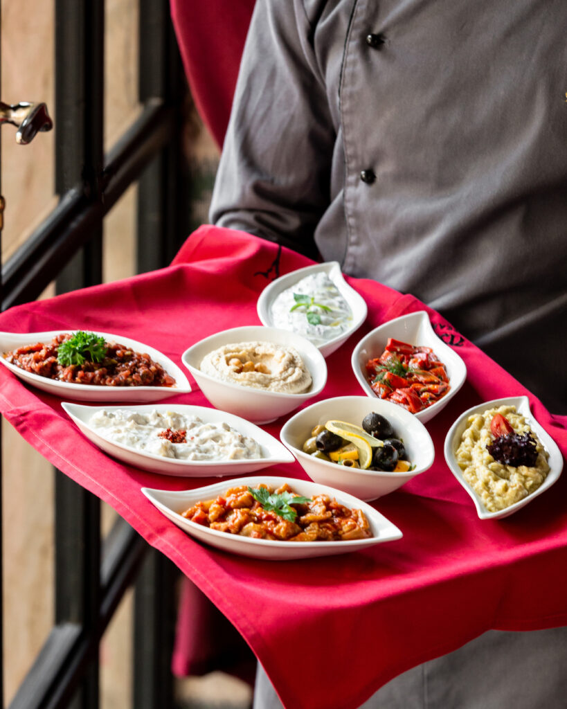 "Catering staff serving freshly prepared meals in a corporate dining setup."